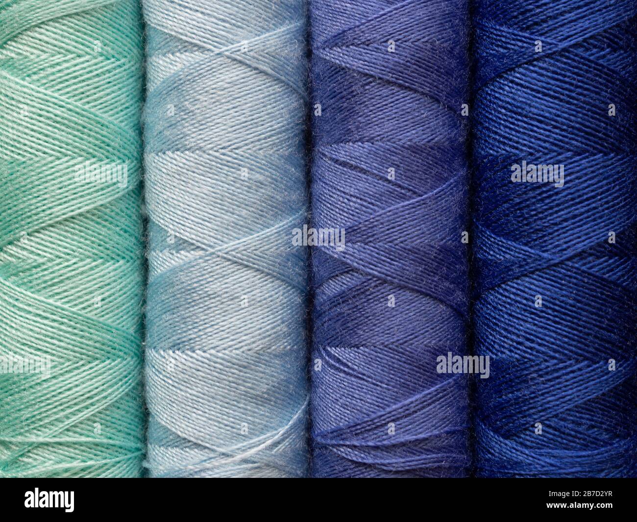 Set of multihue thread bobbins. An idea for a colorful background