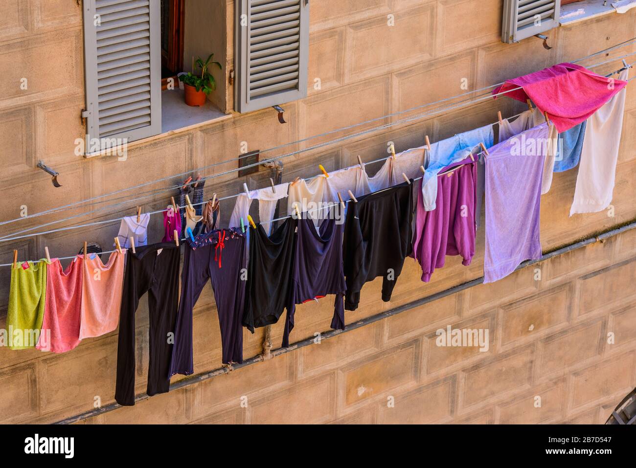 Laundry drying outside windows hi-res stock photography and images - Alamy