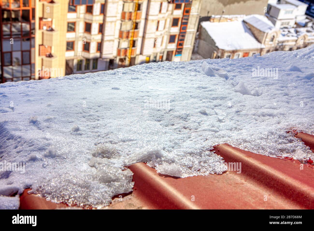 melting snow on the roof edge Stock Photo Alamy