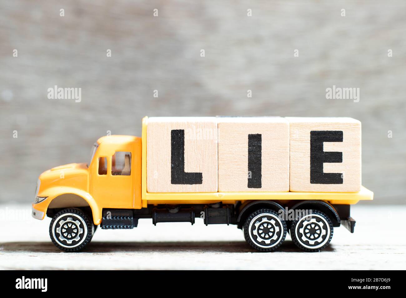 Truck Hold Letter Block In Word Lie On Wood Background Stock Photo Alamy