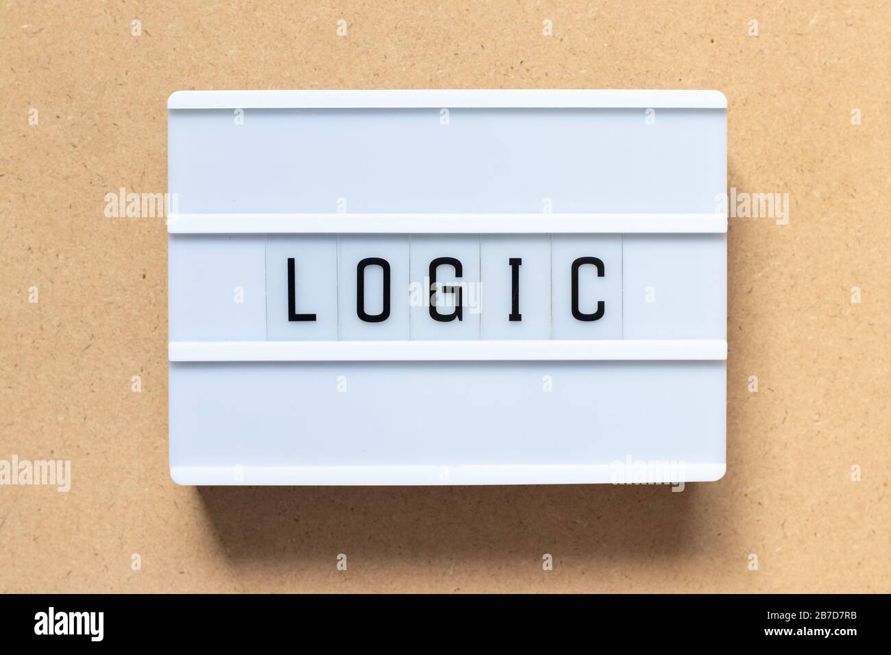 White lightbox with word logic on wood background Stock Photo - Alamy