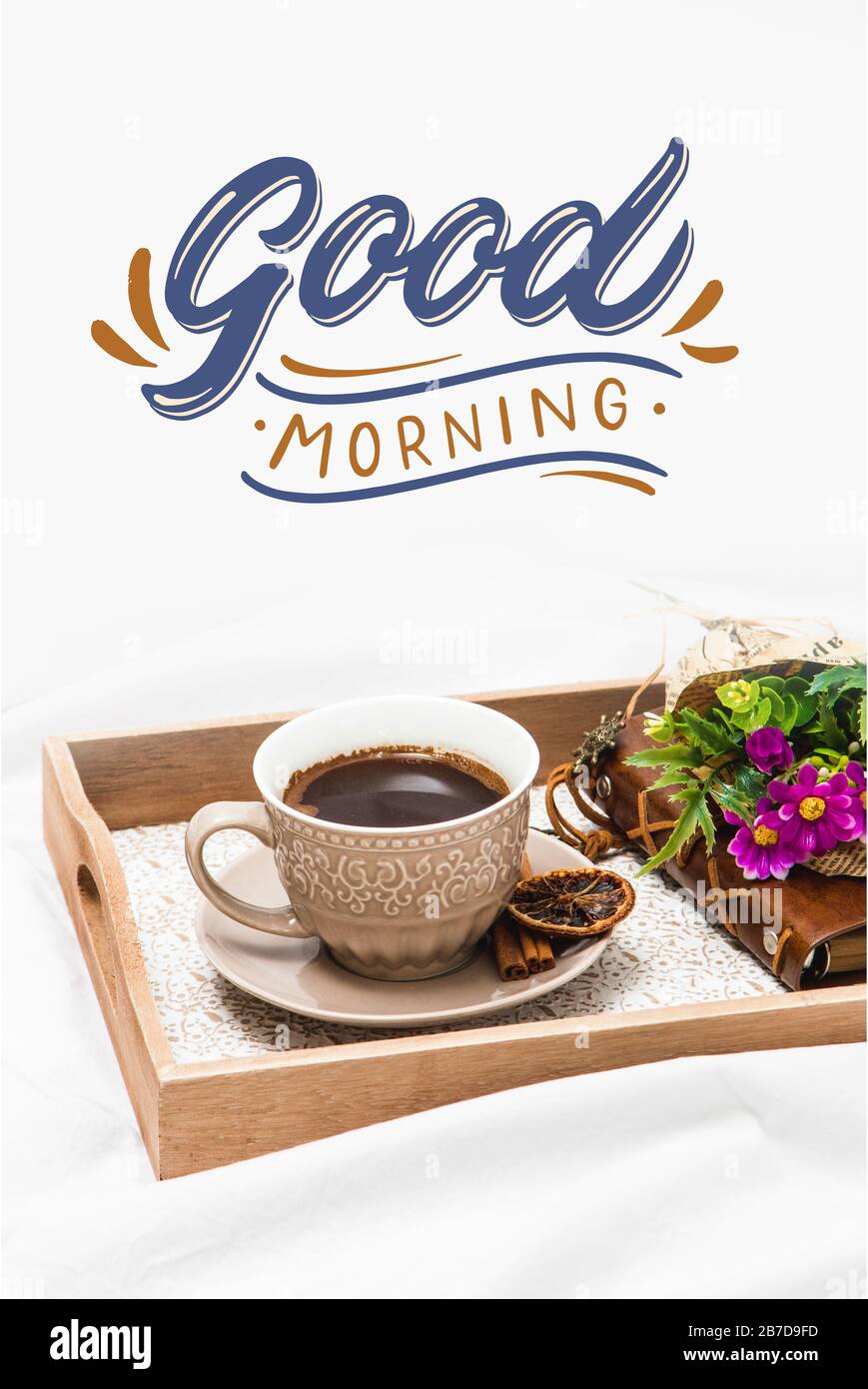 Fresh morning coffee on a board on a bed sheet with text Good ...