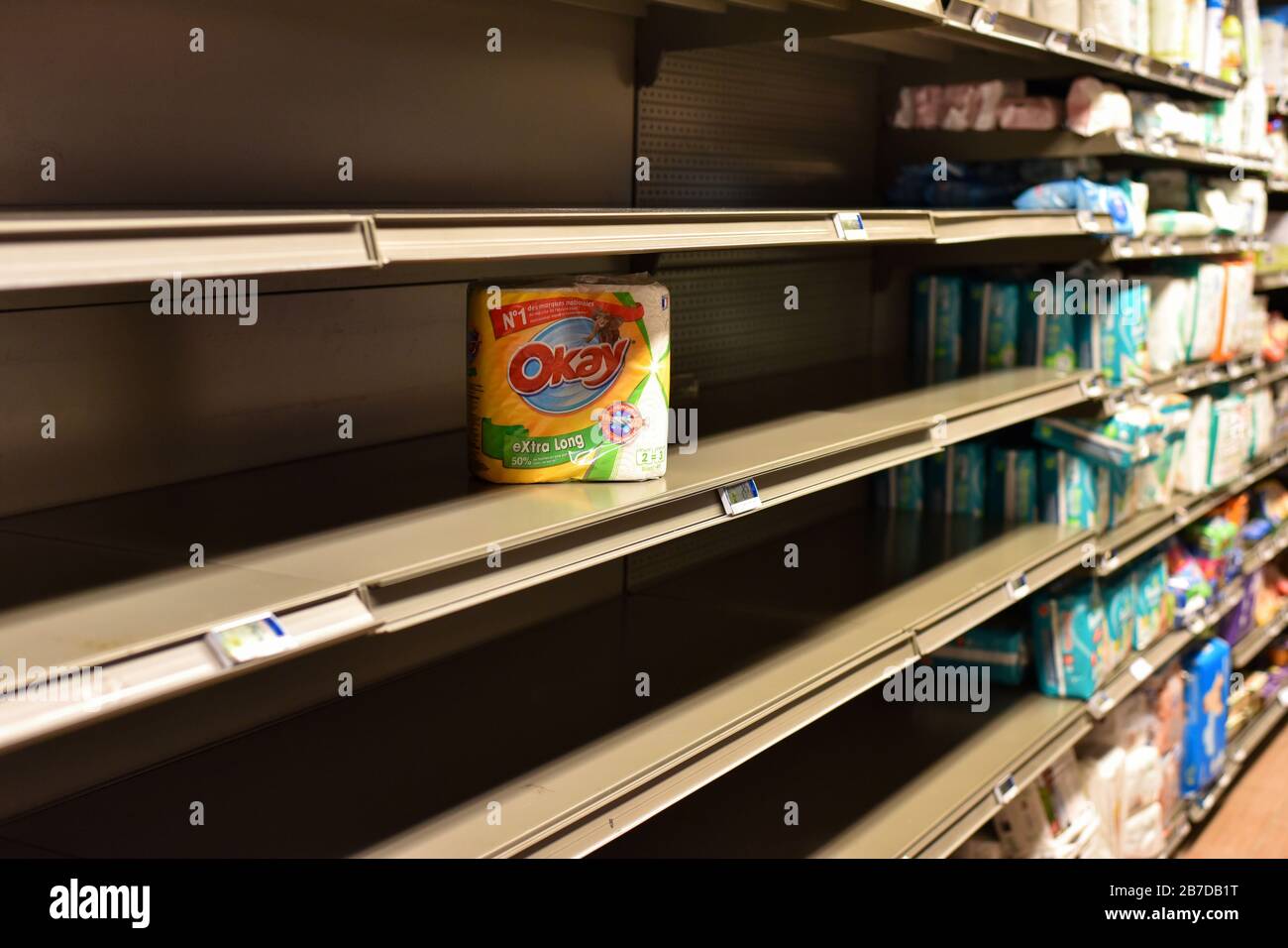 PARIS, FRANCE - MARCH 15, 2020: Toilet paper shortage on the shelves of French supermarkets from coronavirus panic. Stock Photo