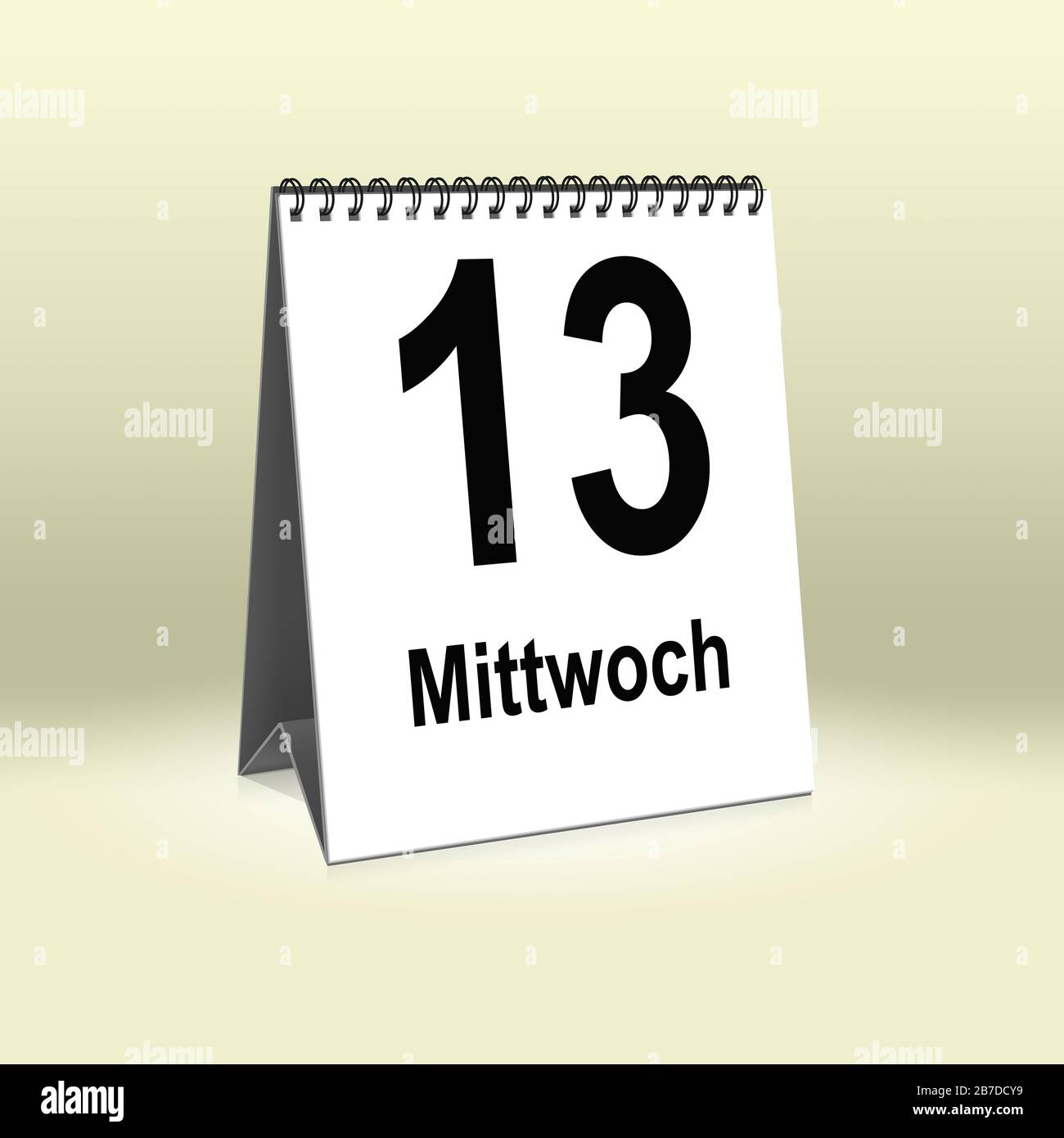 A calendar in German language shows Wednesday 13th | Ein Kalender für den Schreibtisch zeigt Mittwoch 13. Stock Photo