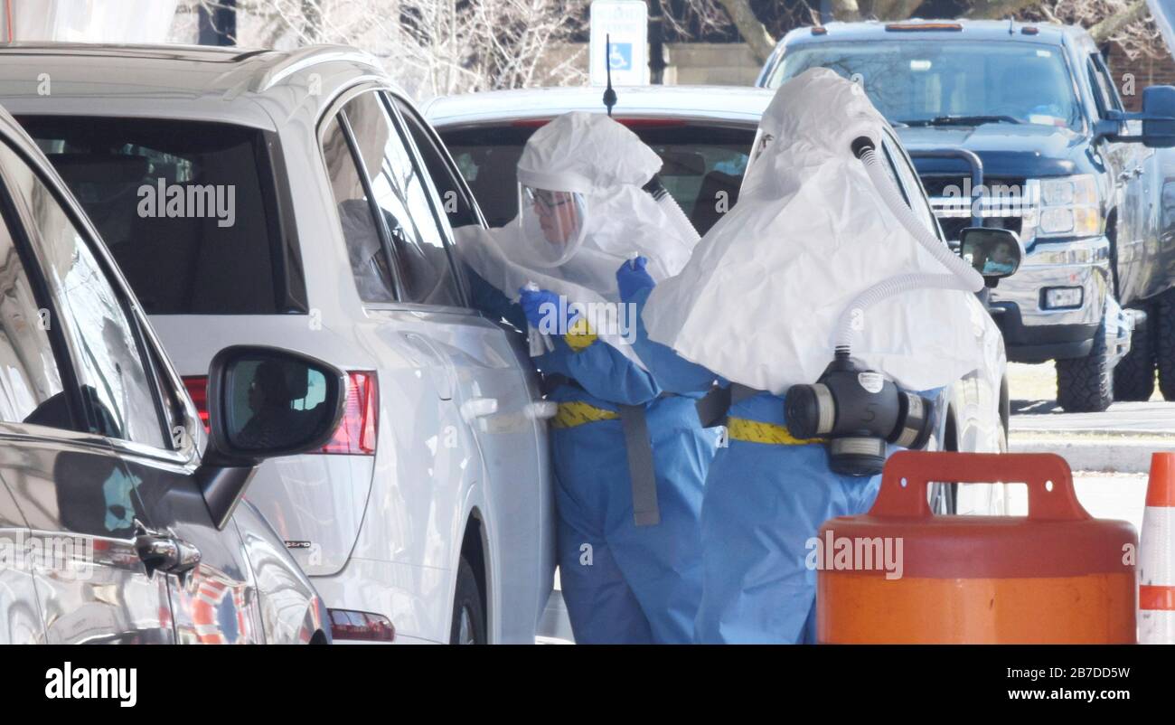 New Rochelle, USA. 15th Mar, 2020. Medical professionals take oral swabs to test for the COVID-19, coronavirus at a newly opened drive through testing facility March 14, 2020 in New Rochelle, New York. Credit: Sean Madden/Planetpix/Alamy Live News Credit: Planetpix/Alamy Live News Stock Photo