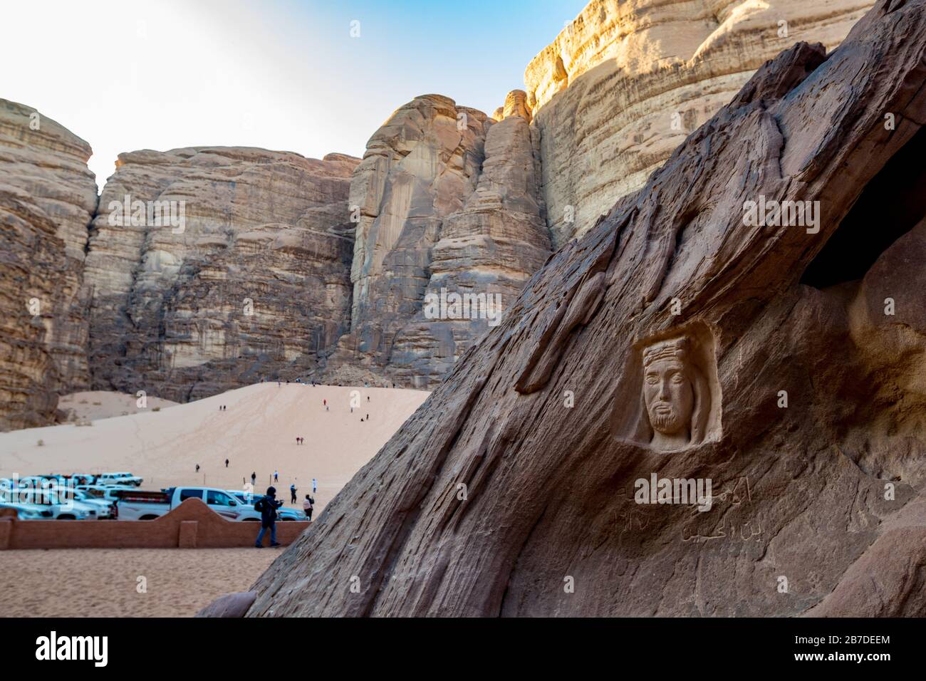 WADI RUM, JORDAN - JANUARY 31, 2020: Lawrence of Arabia head is carved into the stone in Wadi Rum desert, Jordan. Winter landscape view, safari travel in the beautiful kingdom Stock Photo