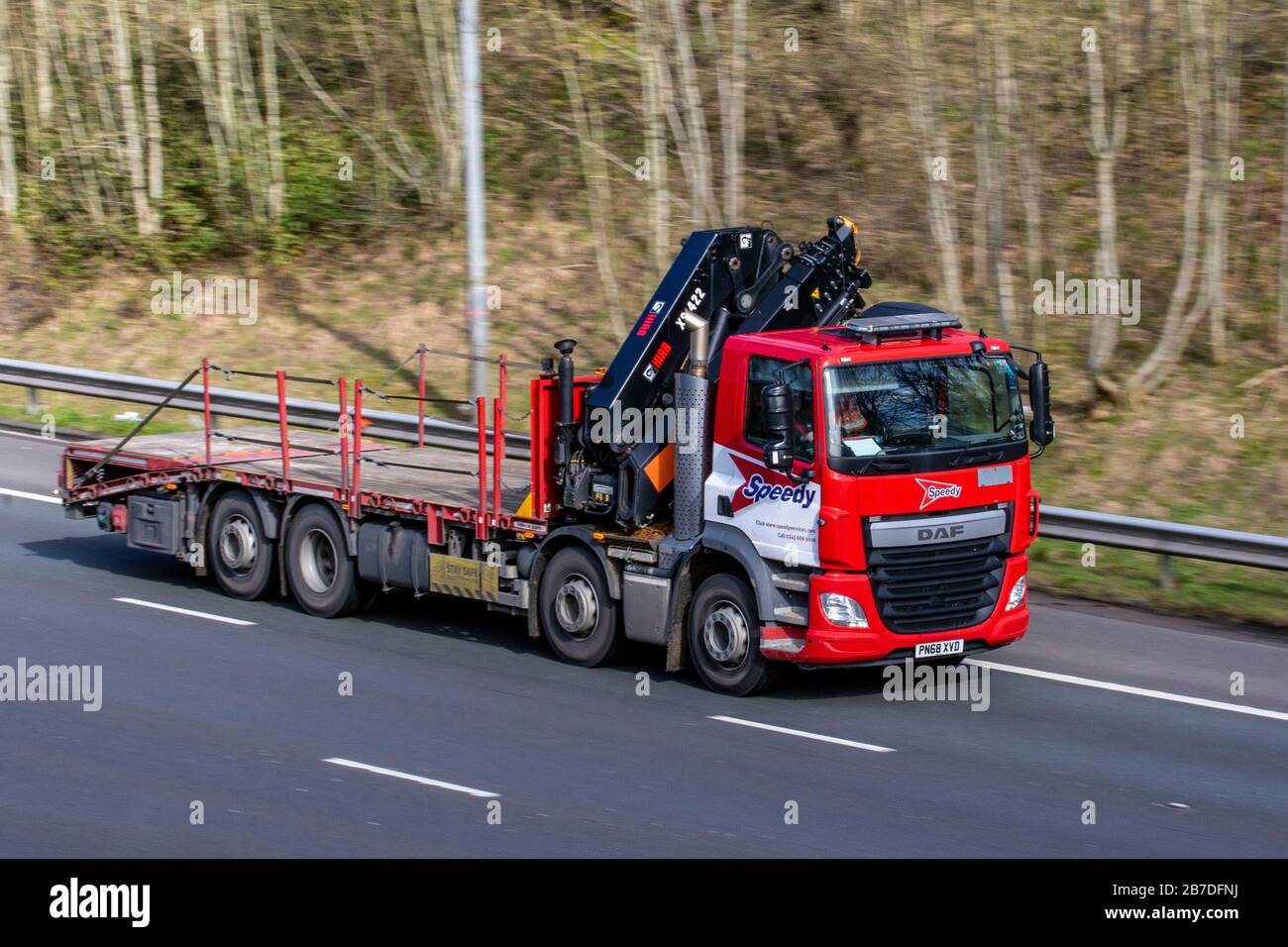 Speedy serices hiab recovery truck; HGV Haulage delivery trucks, lorry, transportation, truck, cargo carrier, DAF vehicle, European commercial transport industry, M61 at Manchester, UK Stock Photo