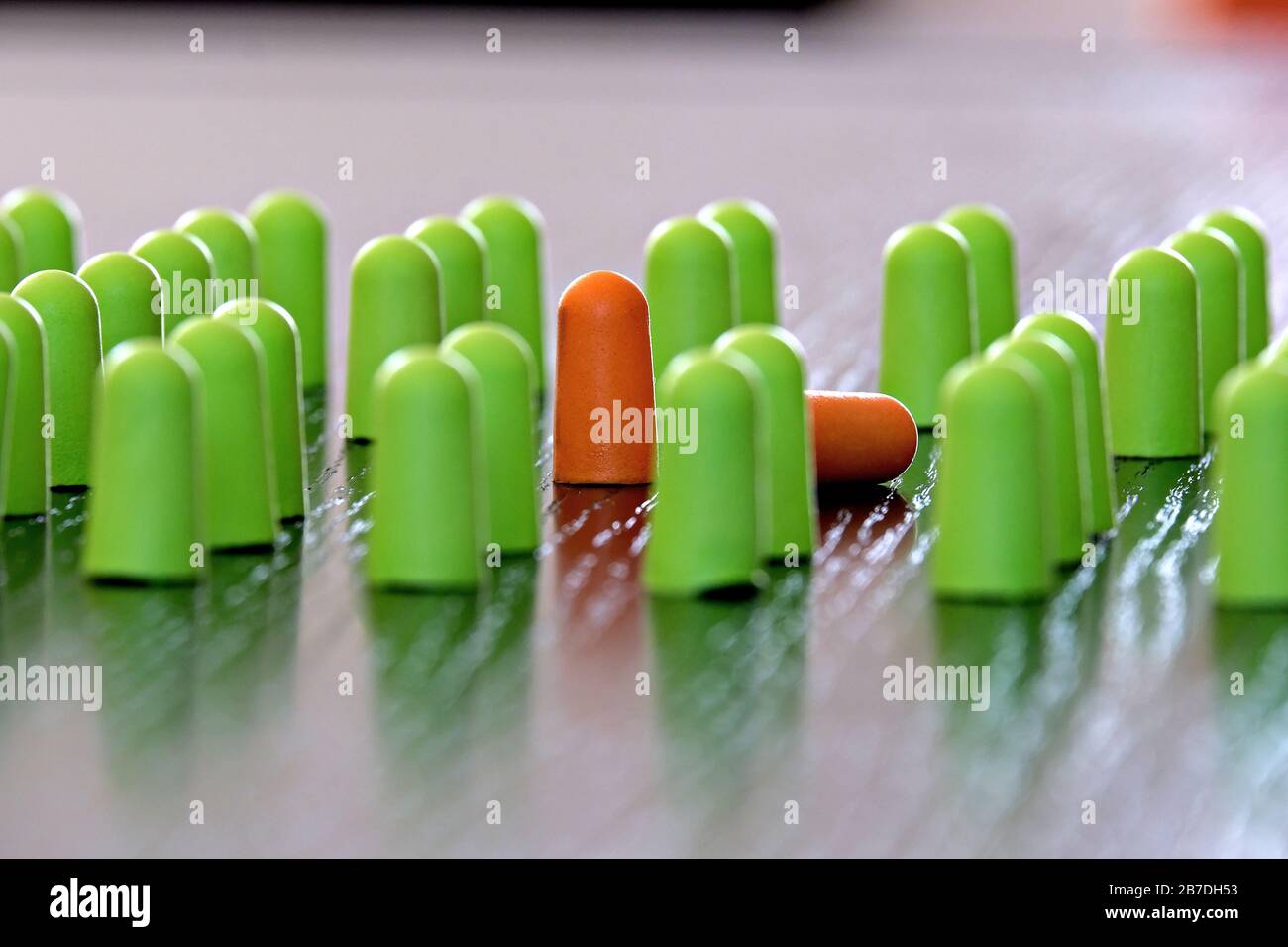 composition of small colored objects on a table that symbolizes a contagious epidemic Stock Photo