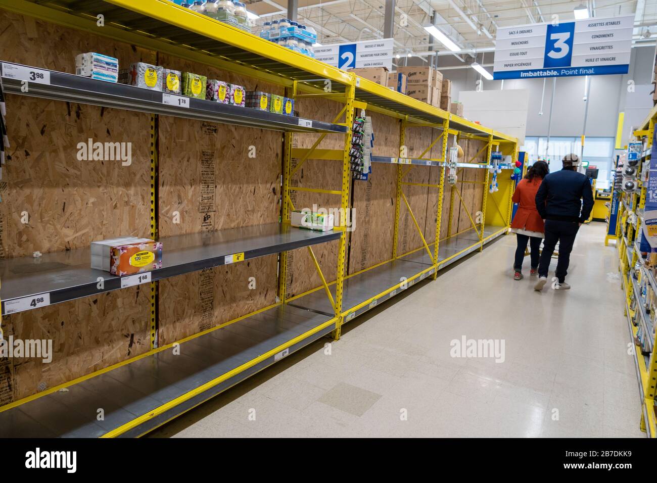 Montreal, CA - 15 March 2020: Empty shelves in a Maxi supermarket. Shortage of supplies due to panic of Coronavirus. Stock Photo