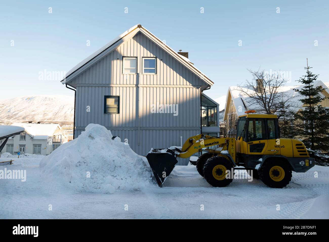 Clearing snow after a heavy snowfall, Tromso, Norway. Stock Photo