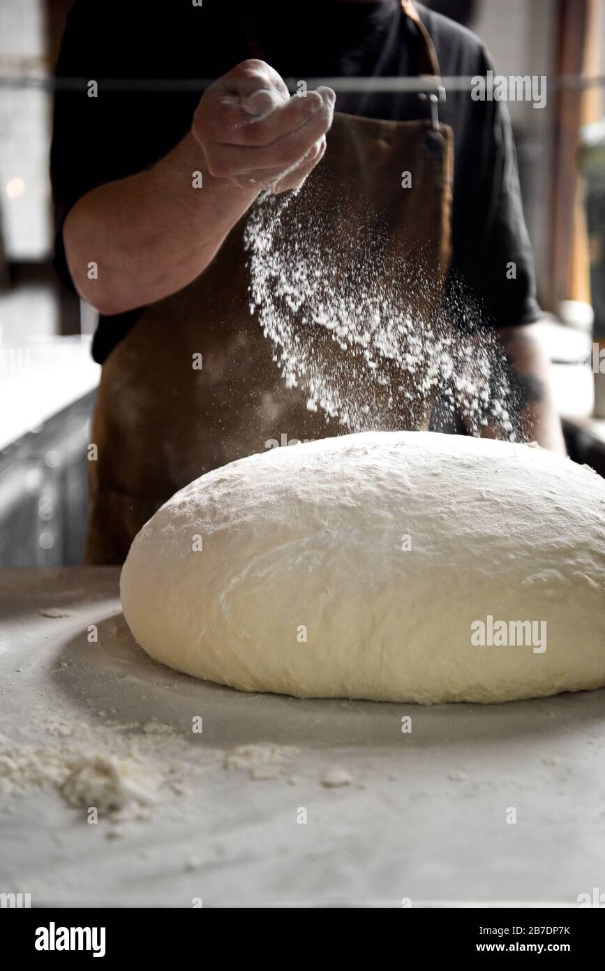 Pizza Dough and Flour with a chef Stock Photo Alamy
