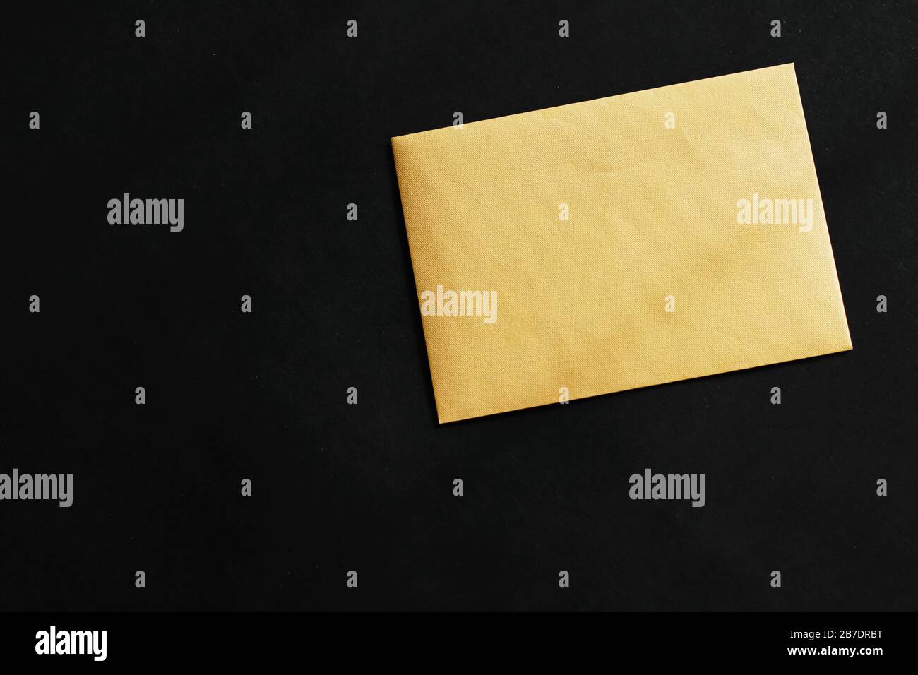Blank golden paper card on black background, premium business and ...