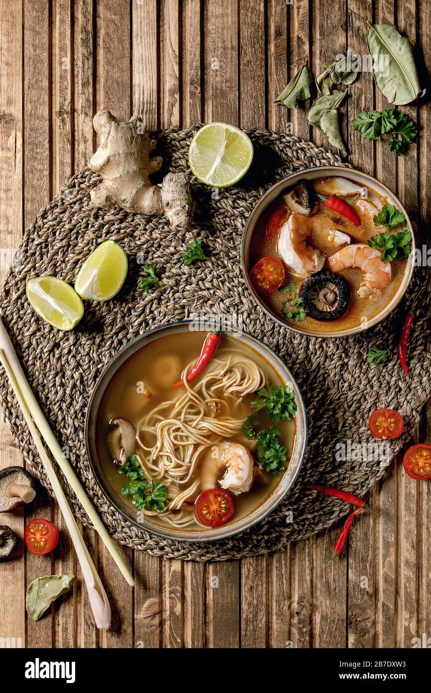 Variety of asian soups. Traditional spicy Thai tom yum kung and noodles soup with shiitake