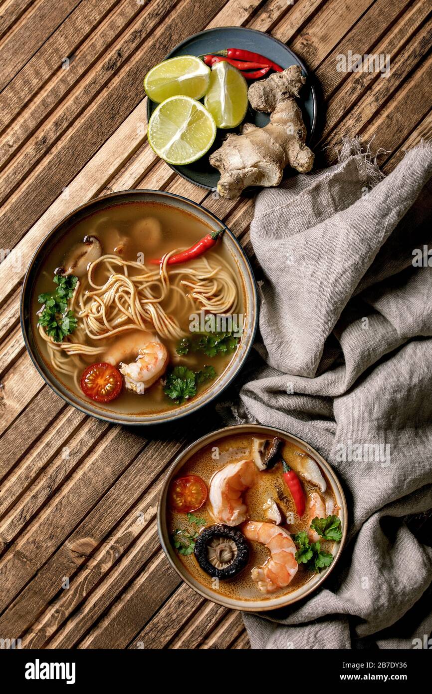 Variety of asian soups. Traditional spicy Thai tom yum kung and noodles soup with shiitake