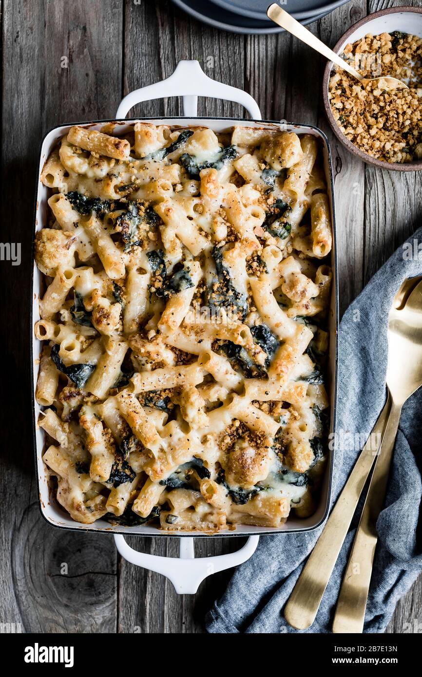 Cheesy cauliflower and kale baked rigatoni with sage breadcrumbs Stock Photo