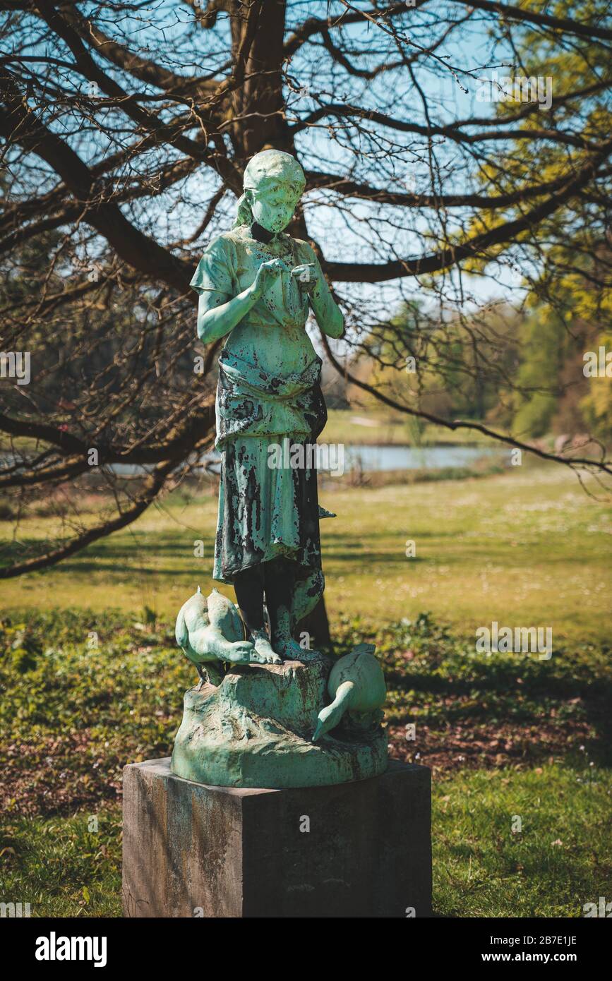 Bronze Statue of the year 1890: The Goose Keeper (La Gardeuse d’oies) by Alphonse De Tombay at the Botanic Garden Meise (National Botanic Garden of Be Stock Photo