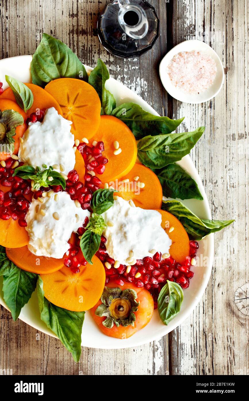 Persimmon Burrata Salad Stock Photo