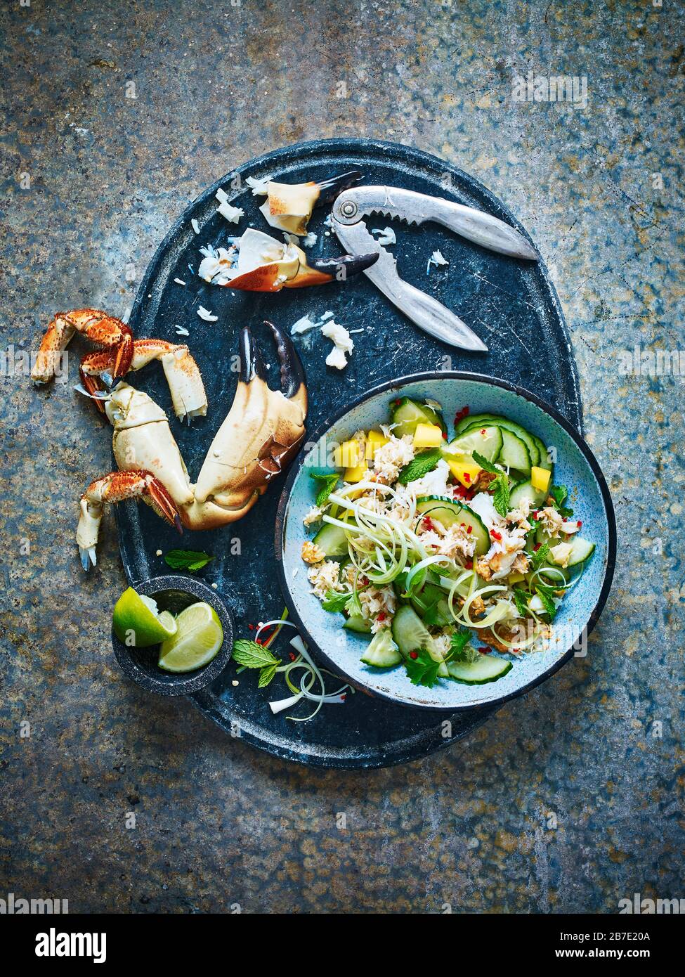 A fresh crab salad, with crabs claw and crab crackers Stock Photo Alamy