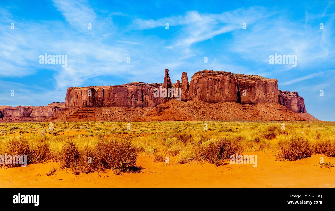 Three Sisters and Mitchell Mesa, a few of the many Red Sandstone Buttes and  Mesas in Monument Valley a Navajo Tribal Park at Utah and Arizona border  Stock Photo - Alamy
