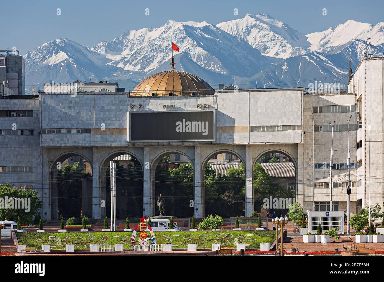 View over the city centre in Alatau Square of Bishkek with snow capped mountains in the background Stock Photo