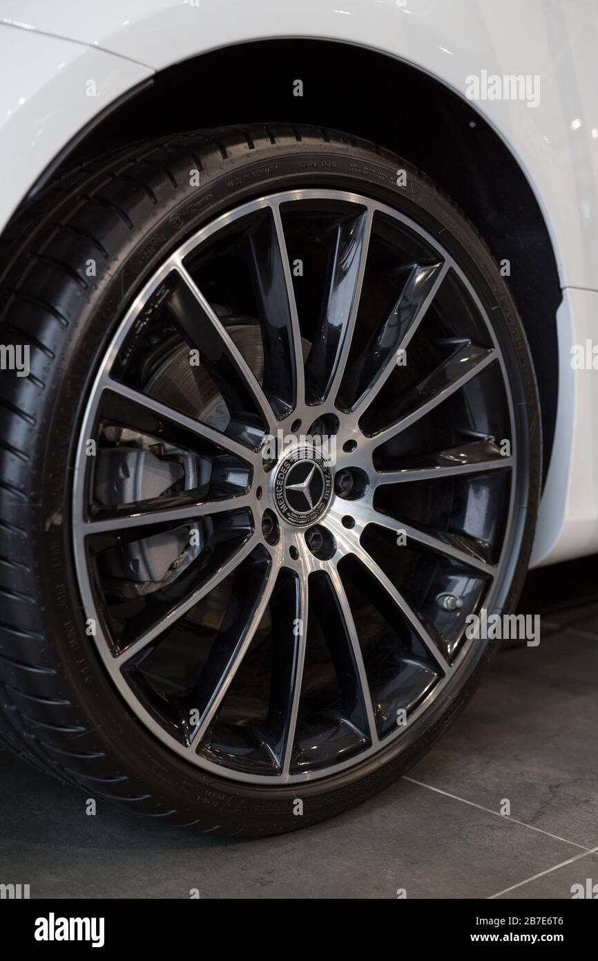 Russia, Izhevsk - February 20, 2020: Mercedes-Benz showroom. The wheel with alloy wheel of a new E-200 coupe car. Premium brand. Stock Photo