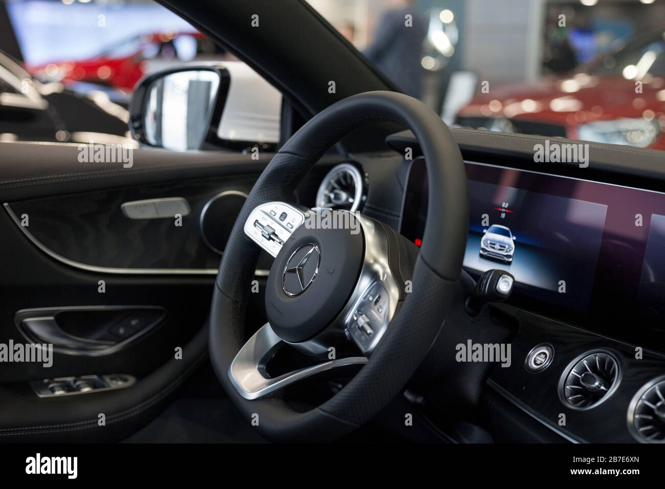Russia, Izhevsk - February 20, 2020: Mercedes-Benz showroom. Interior of new modern E 200 coupe car. Famous world brand. Prestigious vehicles. Stock Photo