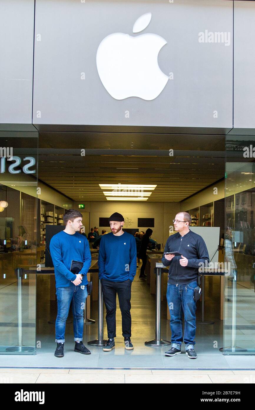 Picture dated March 14th shows staff turning away customers at the Apple store in Cambridge on Saturday morning after all stores were closed due to the Coronavirus outbreak.  Staff and security were seen outside the Apple store in CambridgeÕs Lion Yard today (Sat) after the company closed all its stores across the world for two weeks to help prevent the spread of coronavirus.   The only exception is in China where it has just reopened.   Tim Cook, Apple's CEO, made the announcement on Twitter early this morning (Sat). Stock Photo