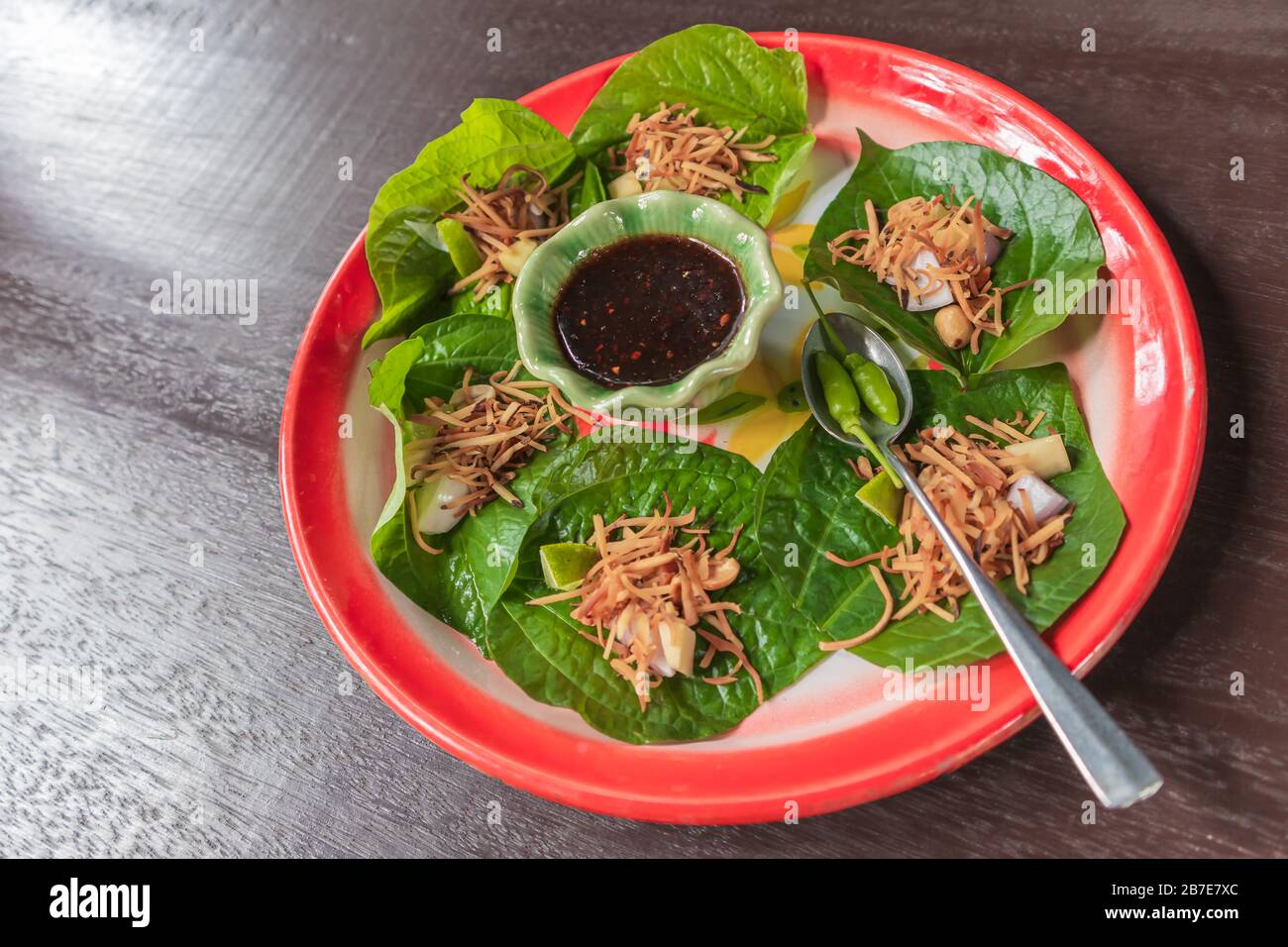 Savory leaf wraps, thai appetizer called "Miang Kham Stock Photo Alamy