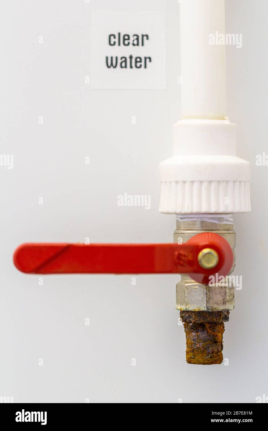 Exterior rusty tap isolated on white wall background Stock Photo