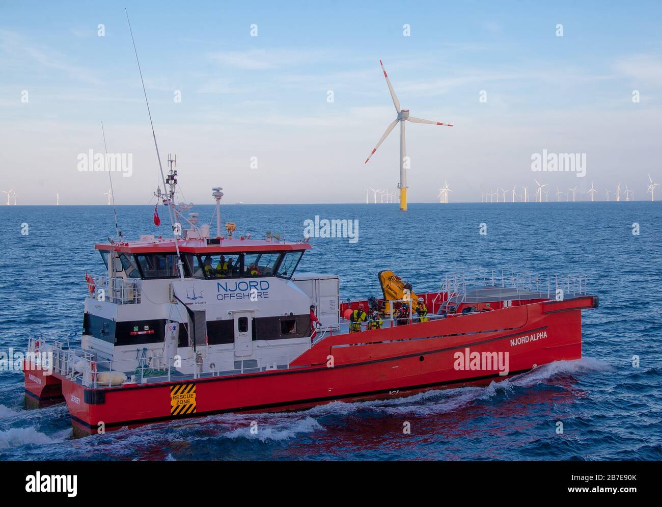 Renewable energy, crew transfer and service operational vessels used in the offshore wind farm industry Stock Photo