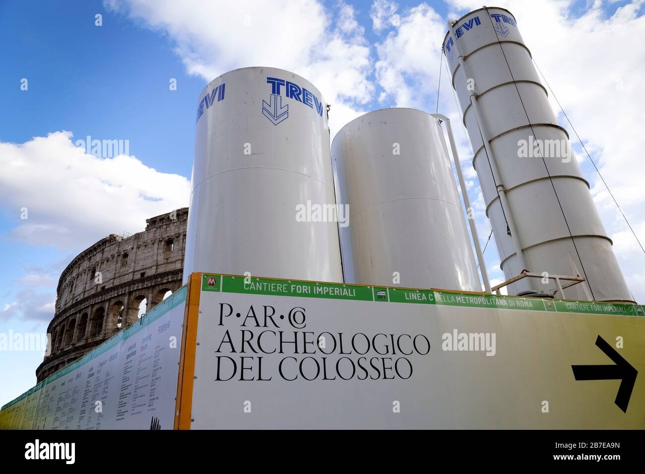Construction site for the new C metro line, subway, underground. Concrete mixing towers. Colosseum on the background. Rome historic centre. Italy, EU Stock Photo