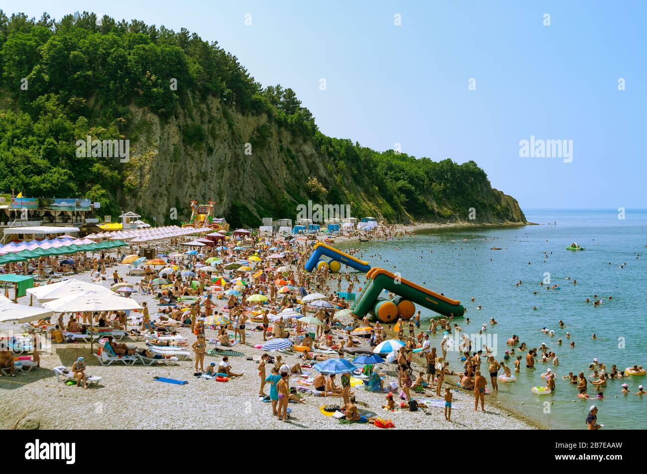 Crowds of bathers on the beach at Black Sea. Olginka. Krasnodar Krai, Russia. Stock Photo