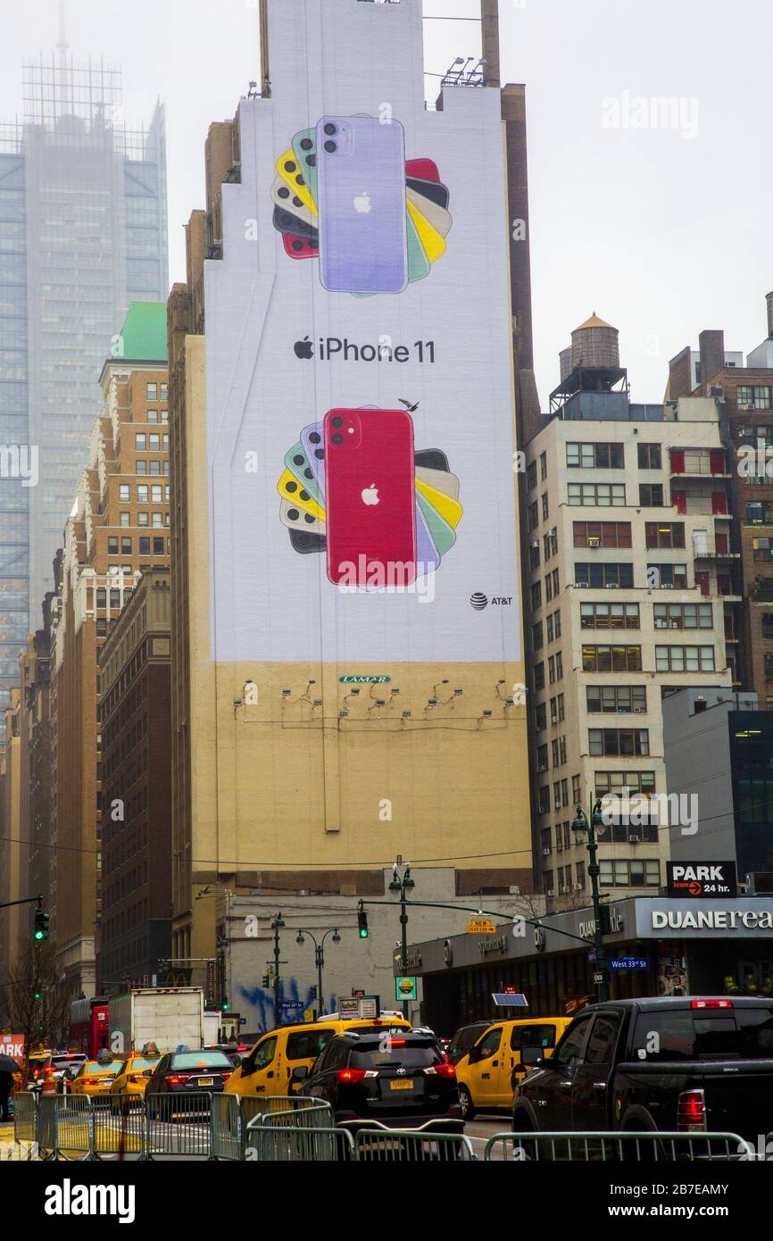 Iphone 11 ad painted on the side of a building along 8th Avenue in midtown Manhattan. Stock Photo