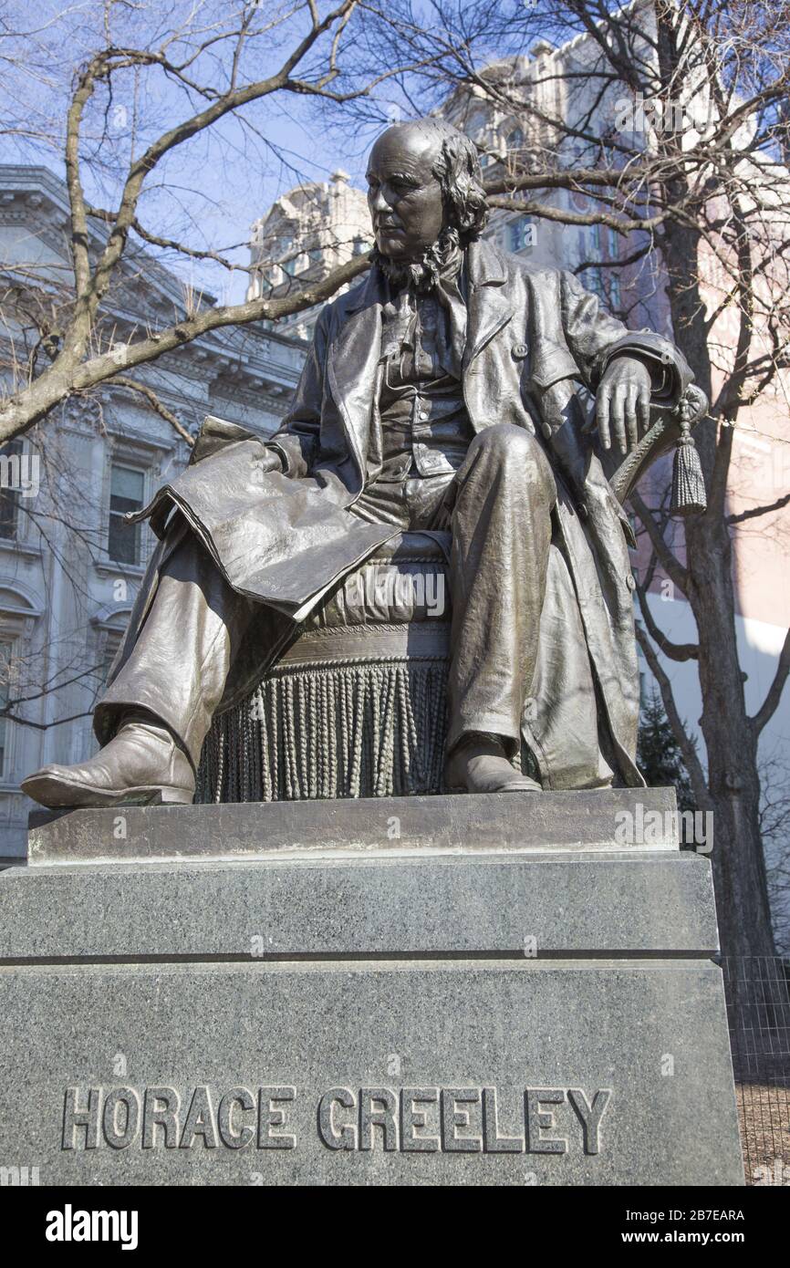 Statue of Horace Greeley, (1916) best known for founding the New York Tribune newspaper at City Hall Park, New York City.  Artist: John Quincy Adams Ward who also did the famous large sculpture of George Washington in front of Federal Hall on Wall Street. Stock Photo