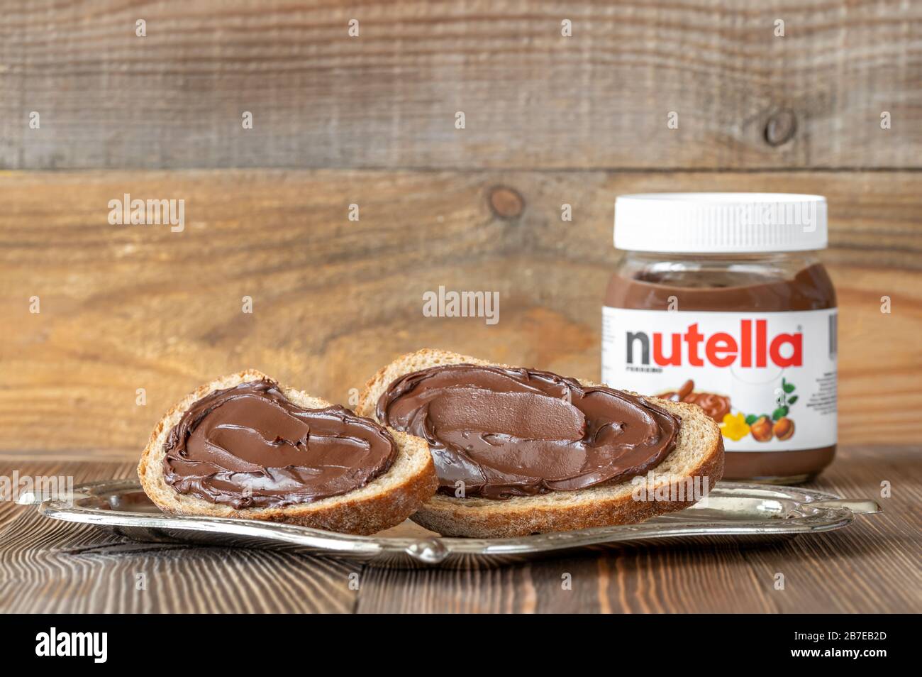 SUMY, UKRAINE - MARCH 12, 2020:  Slices of bread with nutella- world famous Italian hazelnut cocoa spread Stock Photo