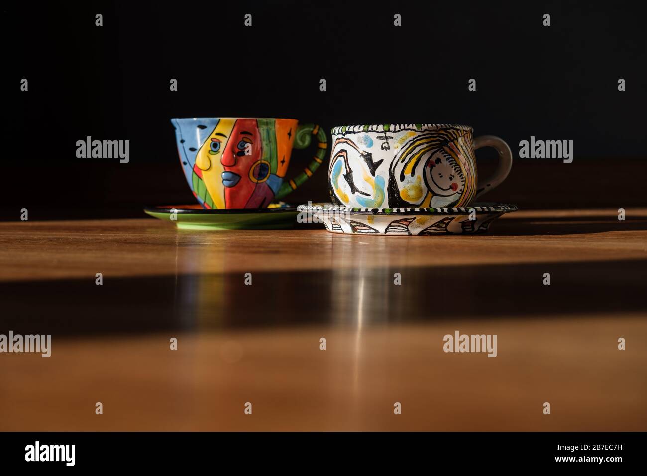 Two Tea and coffee Cups and plates different colour Stock Photo