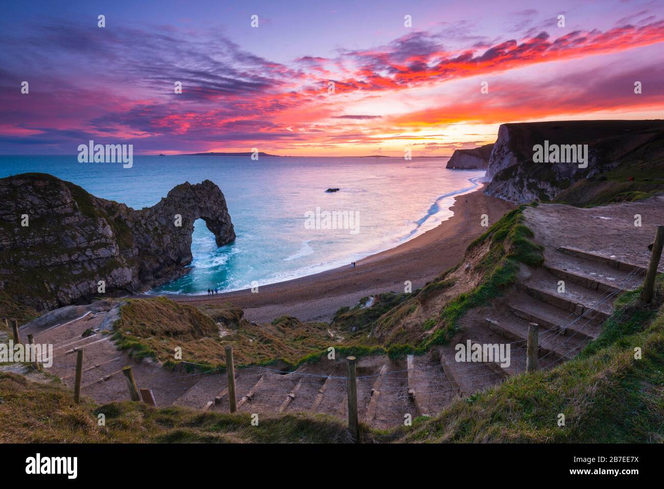 Durdle Door, Lulworth, Dorset, UK.  15th March 2020.  UK Weather.  A spectacular fiery sunset at Durdle Door on the Dorset Jurassic Coast near Lulworth as the cloud clears as high pressure builds in from the South West.  Picture Credit: Graham Hunt/Alamy Live News Stock Photo