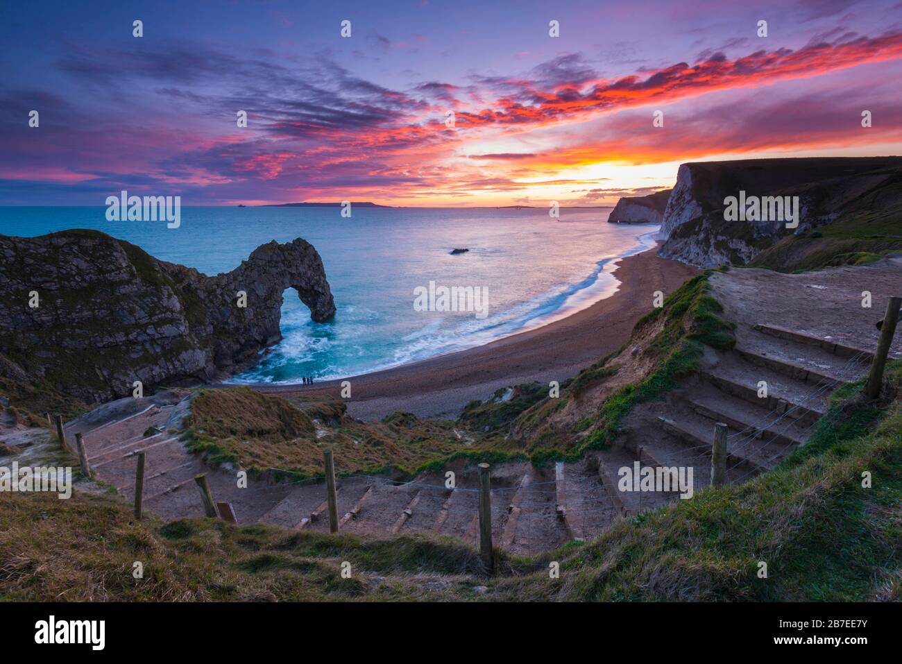 Durdle Door, Lulworth, Dorset, UK.  15th March 2020.  UK Weather.  A spectacular fiery sunset at Durdle Door on the Dorset Jurassic Coast near Lulworth as the cloud clears as high pressure builds in from the South West.  Picture Credit: Graham Hunt/Alamy Live News Stock Photo