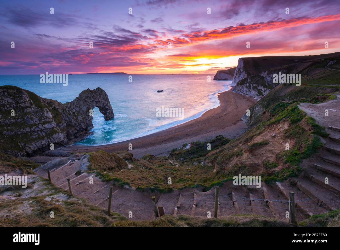 Durdle Door, Lulworth, Dorset, UK.  15th March 2020.  UK Weather.  A spectacular fiery sunset at Durdle Door on the Dorset Jurassic Coast near Lulworth as the cloud clears as high pressure builds in from the South West.  Picture Credit: Graham Hunt/Alamy Live News Stock Photo