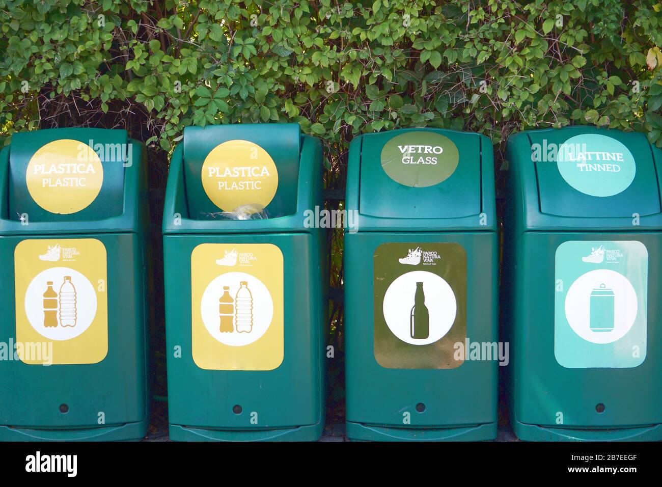 Waste management signs and symbols on a garbage bin Stock Photo