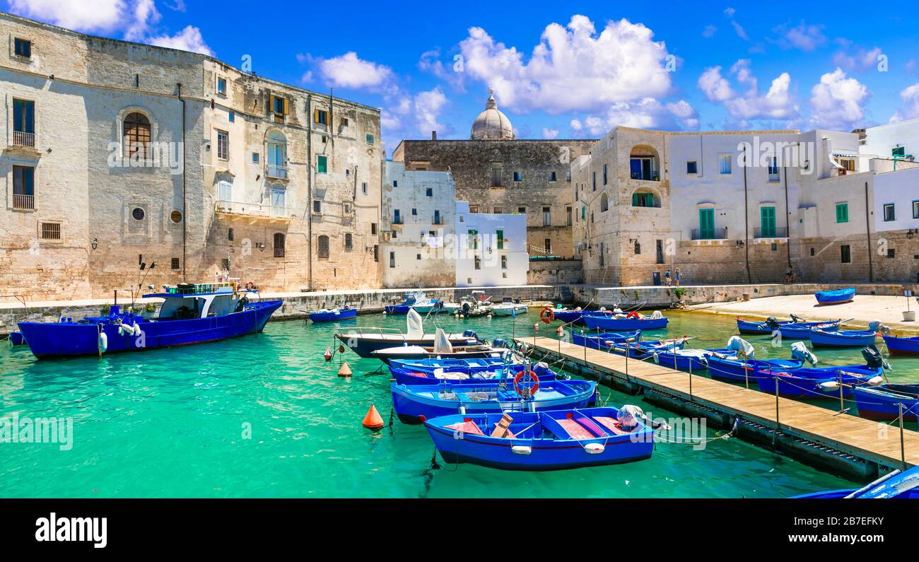 Turquoise sea,boats and white houses in Monopoli old town,Puglia,Italy. Stock Photo