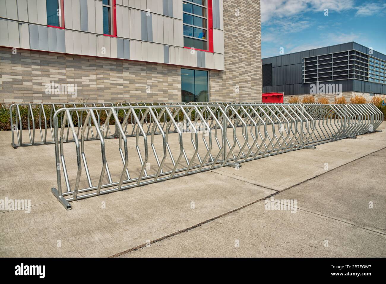 Bike parking of an elementary school building, backside. Sunny spring day. Stock Photo