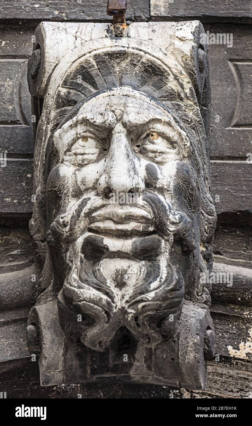 Venice, Italy - MAY 17, 2019: Bas-relief of a male face with a beard on the wall Stock Photo