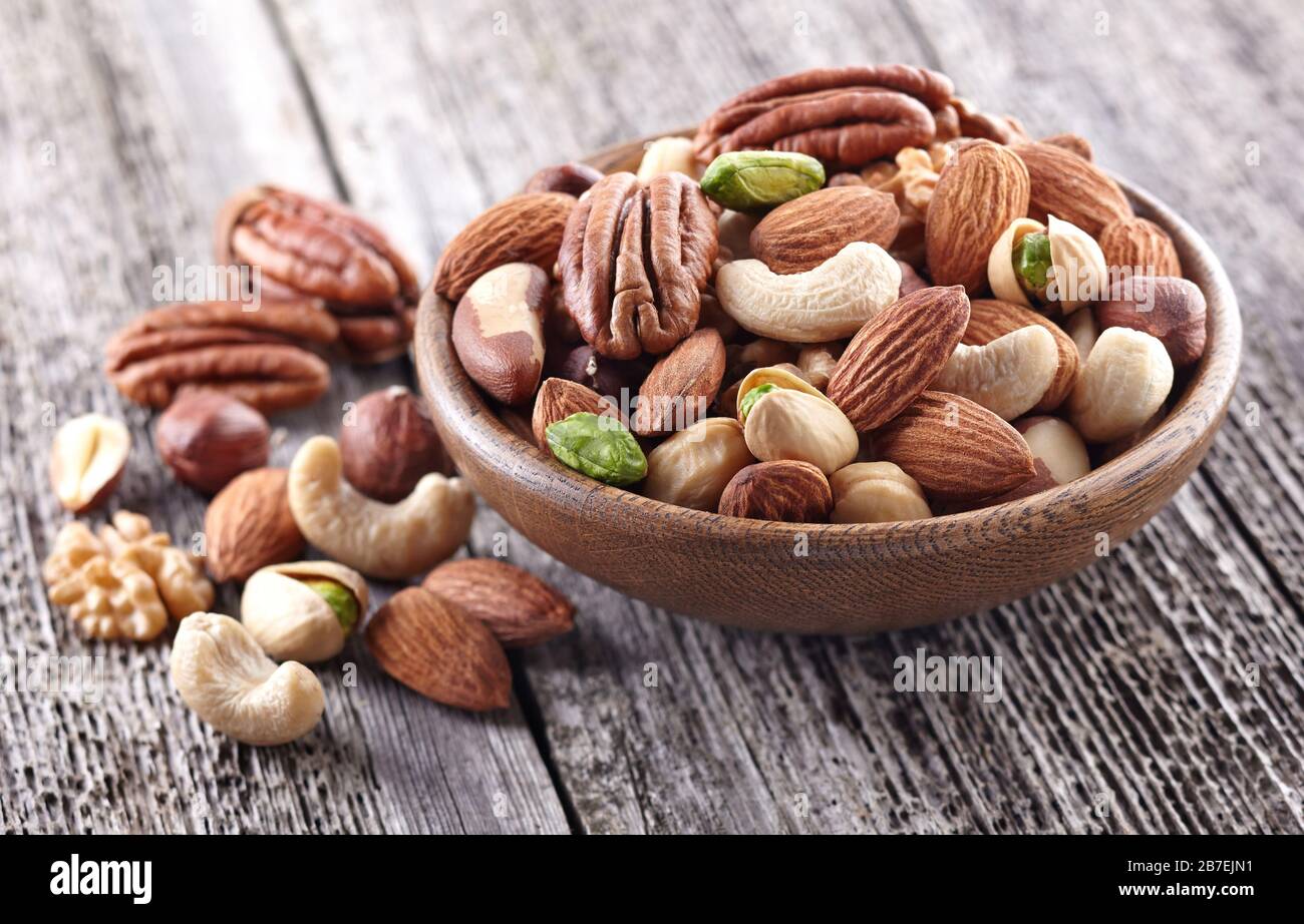 Nuts mix on a wooden background Stock Photo