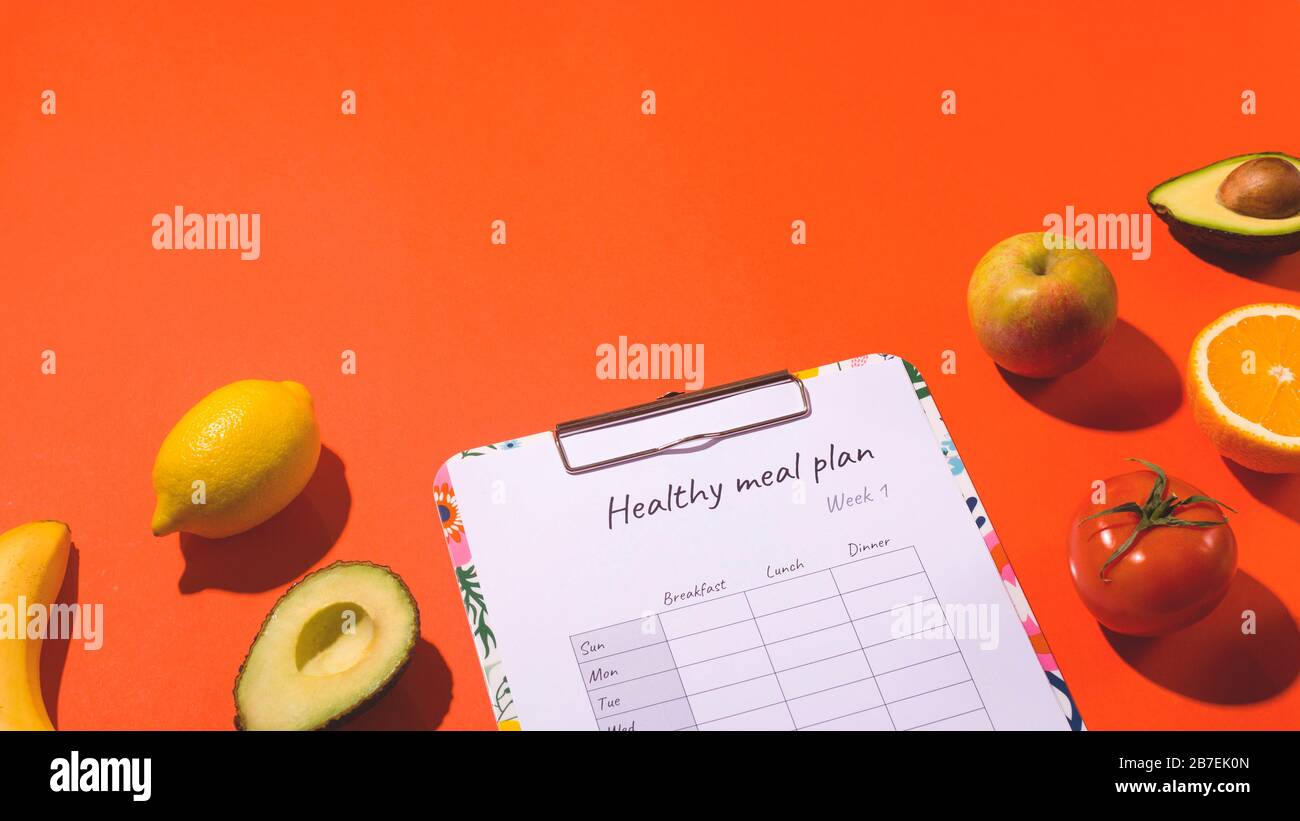 Healthy weekly meal plan among fresh organic fruits and vegetables ...