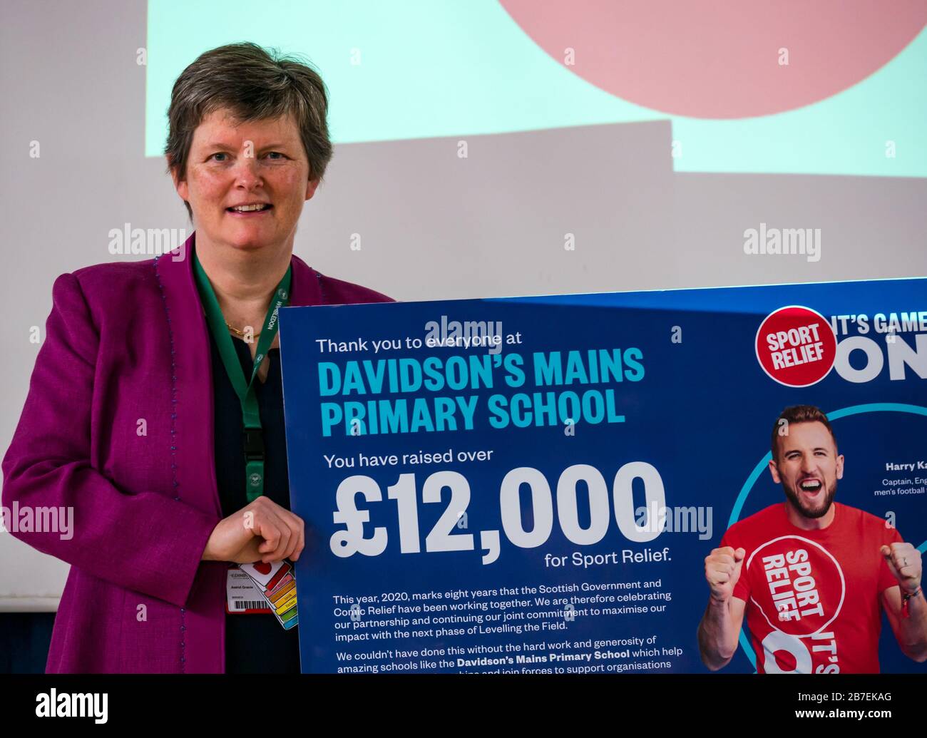 Astrid Gracie, Headteacher with Sport Relief poster for raising funds for the charity, Davidsons Mains primary school, Edinburgh, Scotland, UK Stock Photo