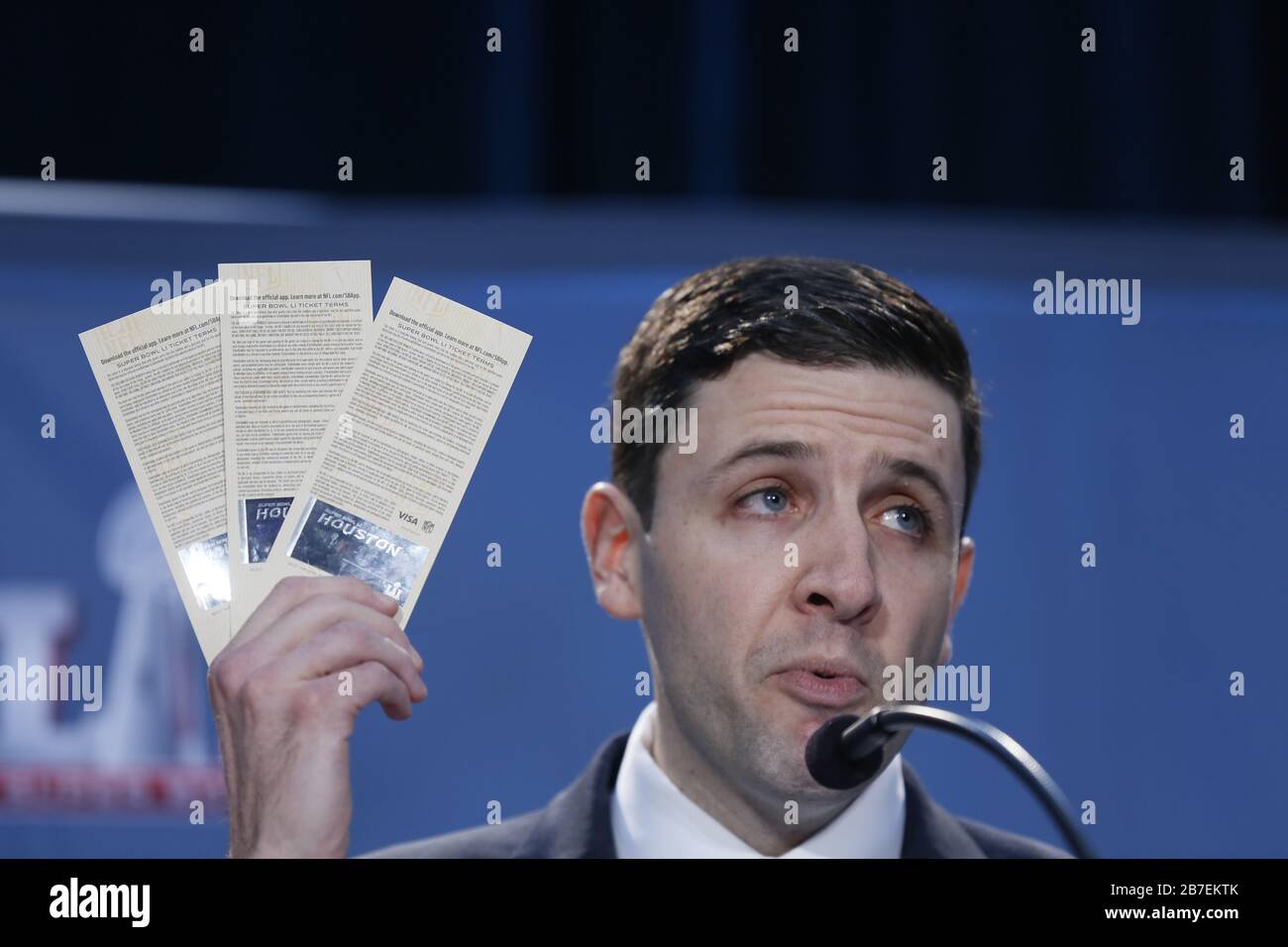 NFL Senior Counsel Michal Buchwald holds up counterfeit Super Bowl tickets during a joint press conference on Operation Team Player at the George R. Brown Convention Center February 2, 2017 in Houston, Texas. Stock Photo