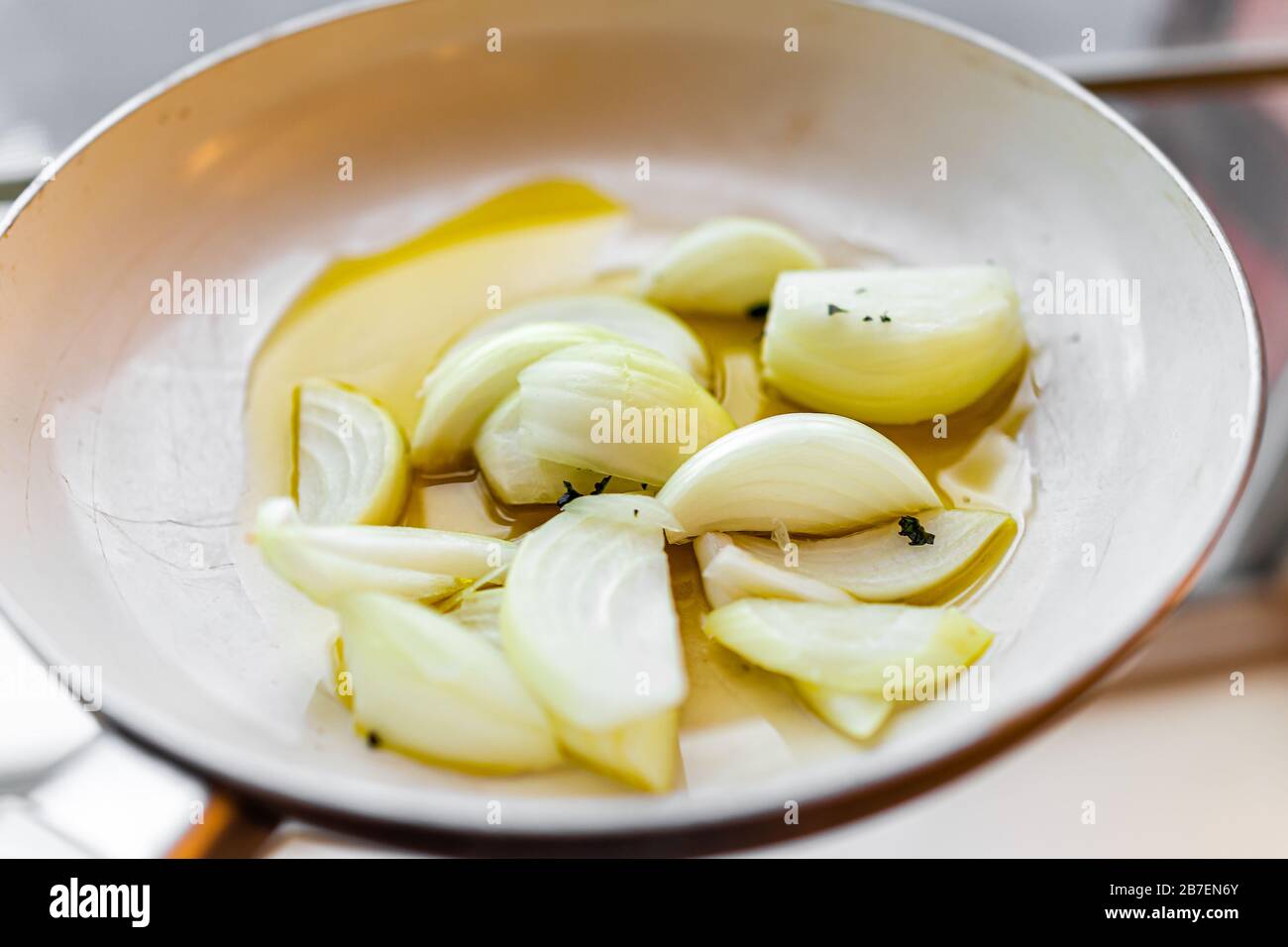 Frying pan with chopped onions shallots vegetables macro closeup