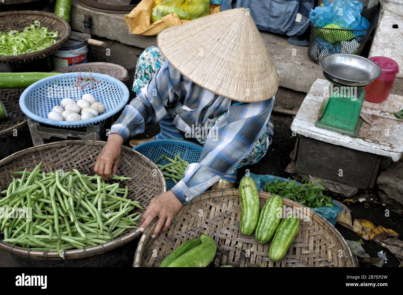 Street saleswoman at Dong Ba market in Hue, Vietnam Stock Photo