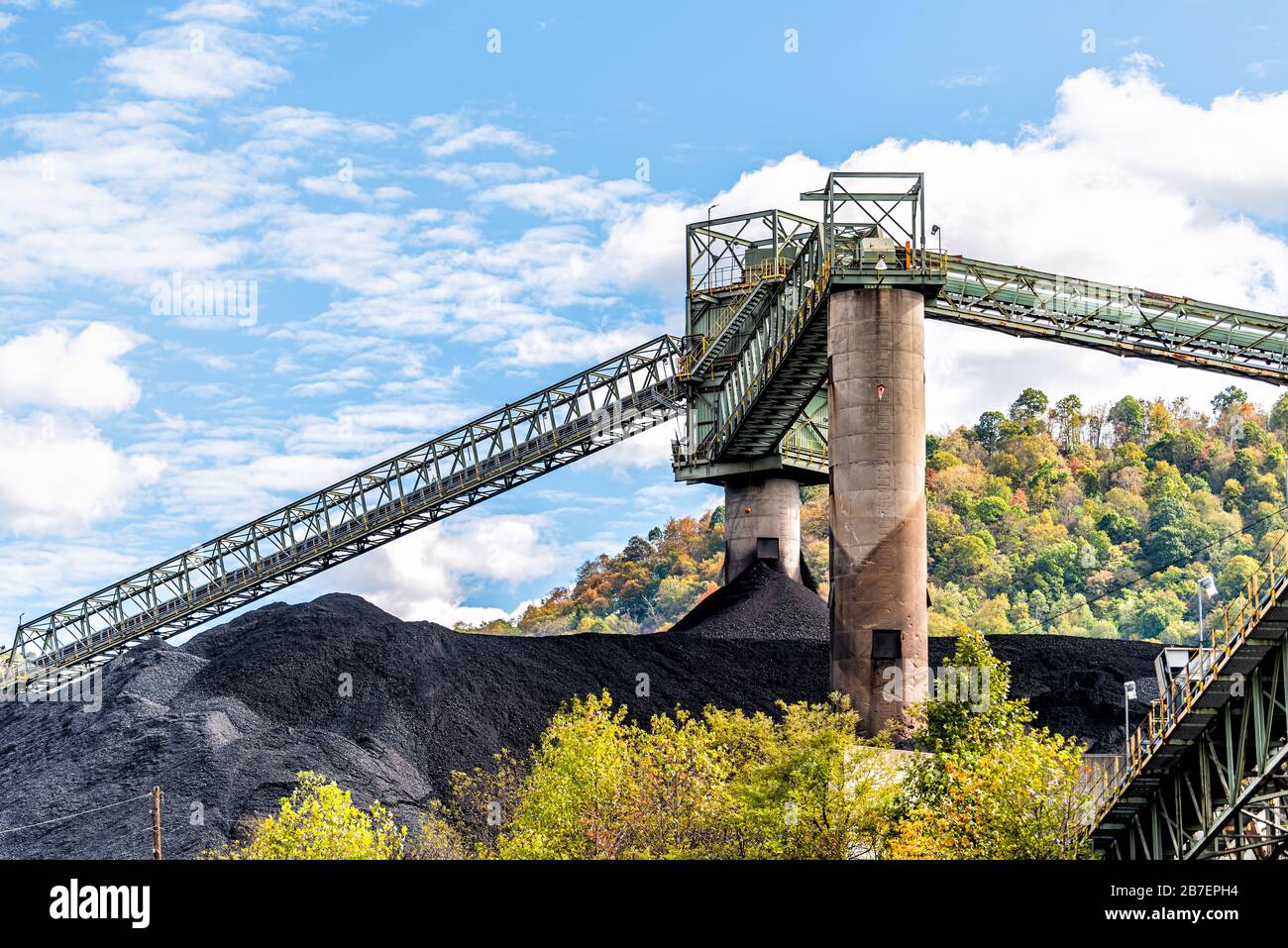 Charleston, West Virginia, USA city with coal mound and industrial factory conveyor belt power plant exterior architecture with elevator lift Stock Photo